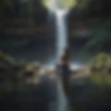 Person meditating by a tranquil waterfall