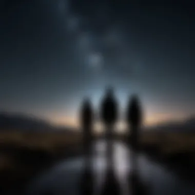 Silhouette of two figures walking towards each other under a starry sky