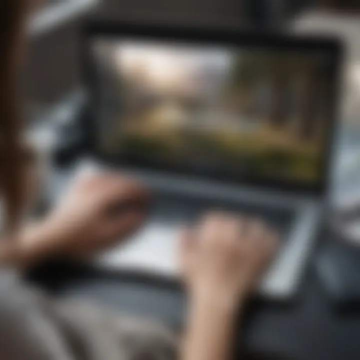 Close-up of a person typing on a laptop with motivational quotes displayed on the screen, emphasizing inspiration in journaling.