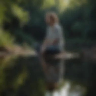 Person sitting in contemplation by the water